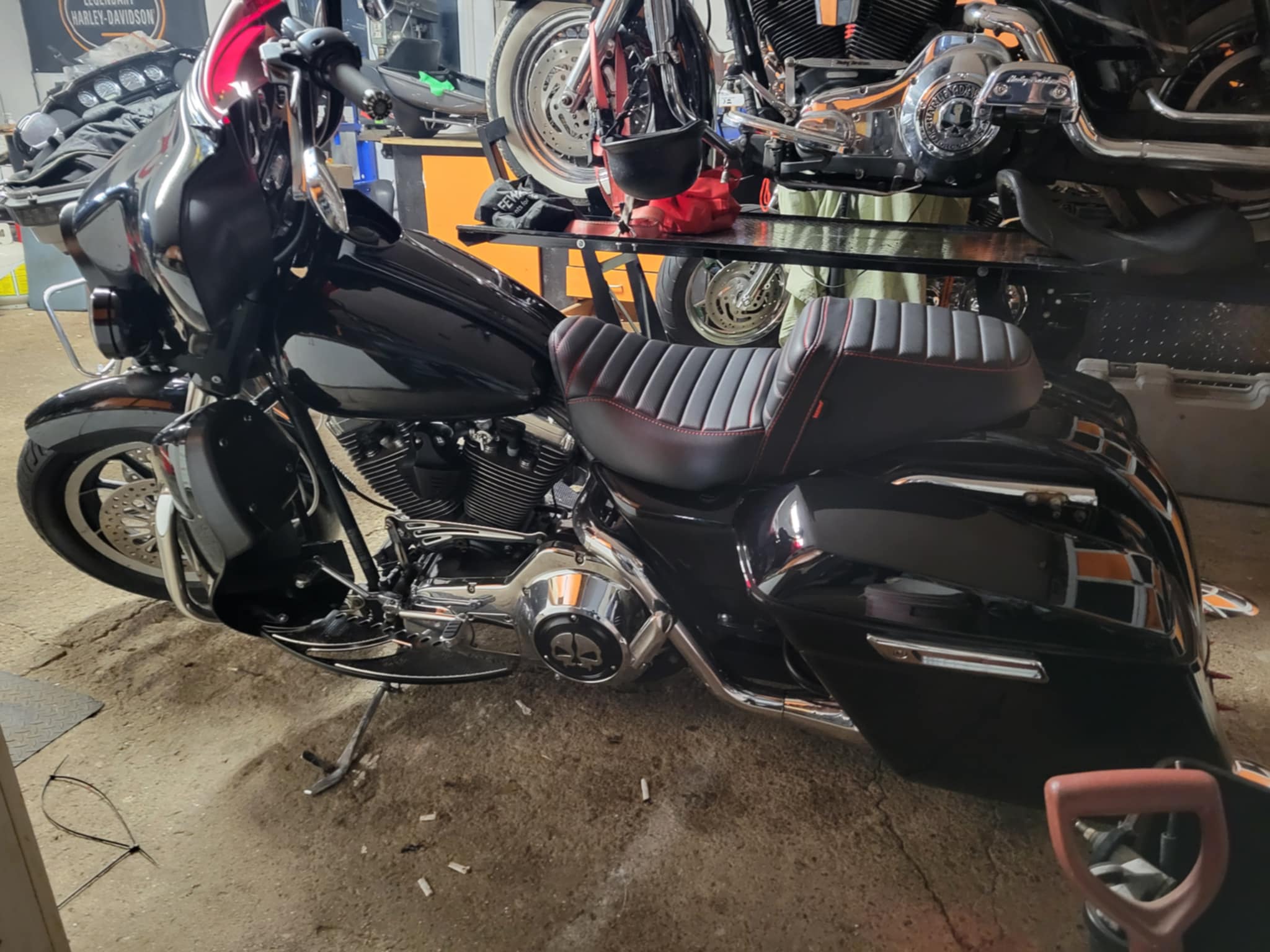 A Harley Davidson side view on a concrete floor
